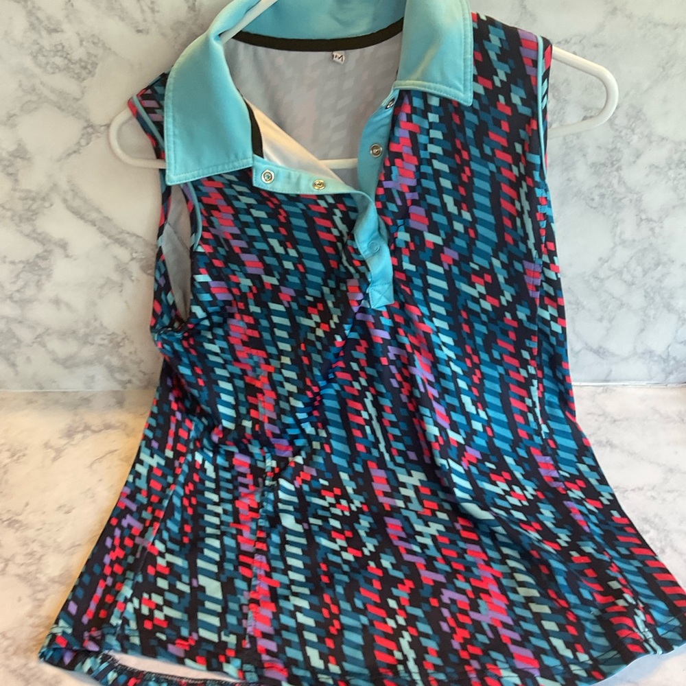 Ashworth  Blue Skort size 8 paired with multicolor geometric top - Picture 2 of 7